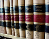 Row of legal textbooks on a shelf