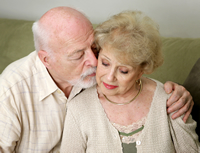 man kissing sad woman