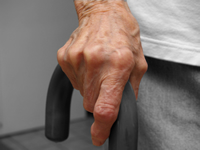 mans hand on cane