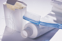 image of oral care products, tooth brush, paste and floss
