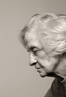 Image of sad elderly woman looking downward