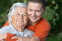 woman holding elderly mother